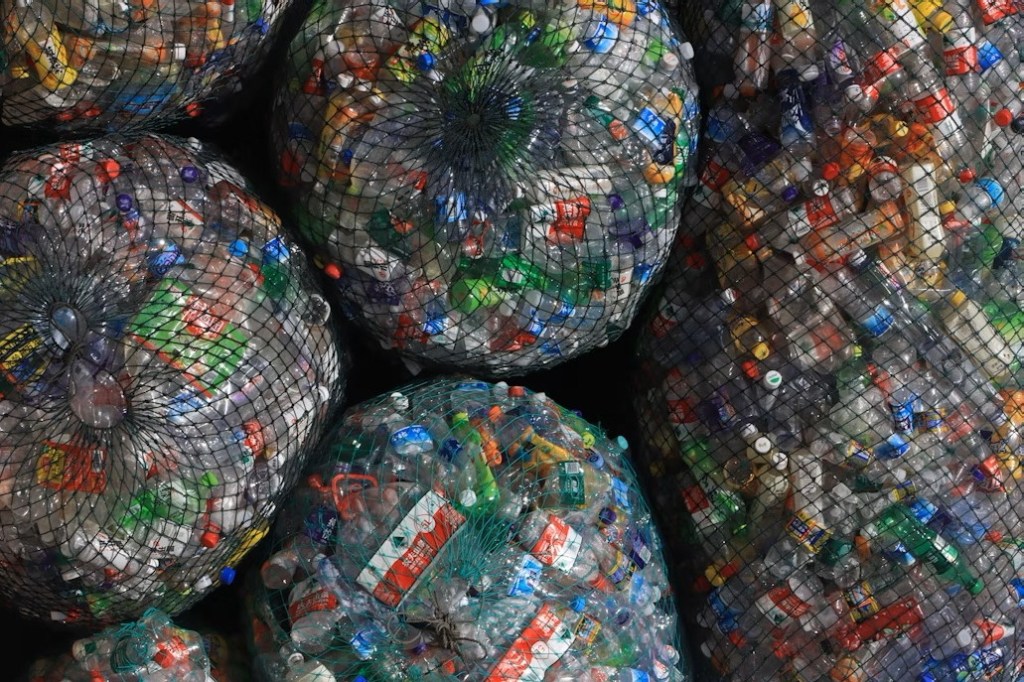 Net bags holding big piles of plastic trash.